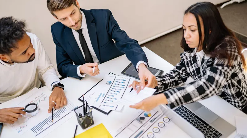 Digital agency team building AI workflows for agencies in a modern office, the shift from web design to managed AI services